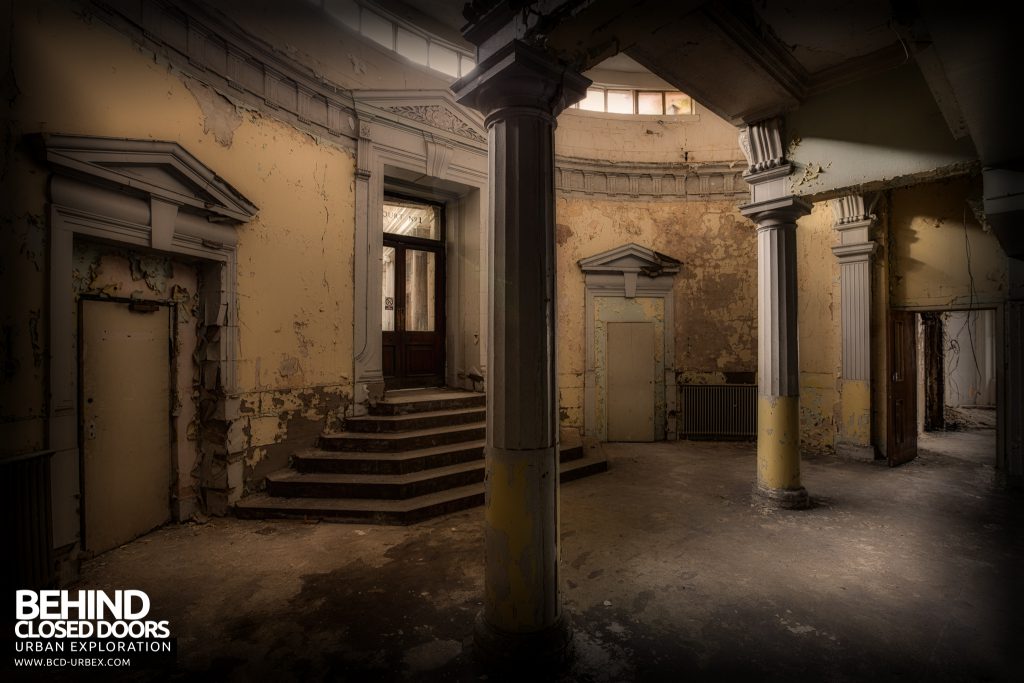 Sheffield Old Town Hall and Crown Courts - Old columns and steps in a decaying room