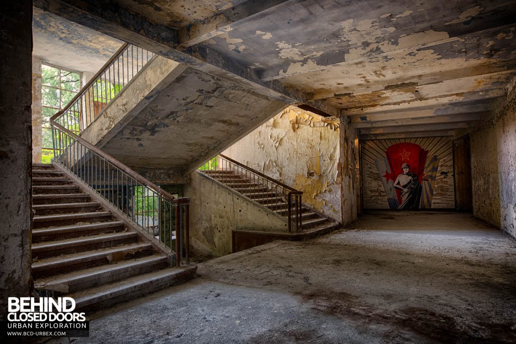 CCCP Flight School - Mural at end of corridor with staircase