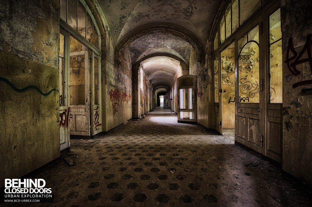 Beelitz Womens Lung Hospital - Corridor with original flooring showing through the dirt