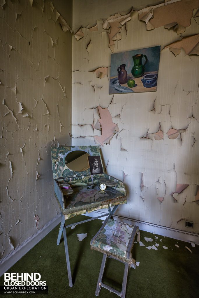 Town Mansion - Table in decaying room with peeling paint