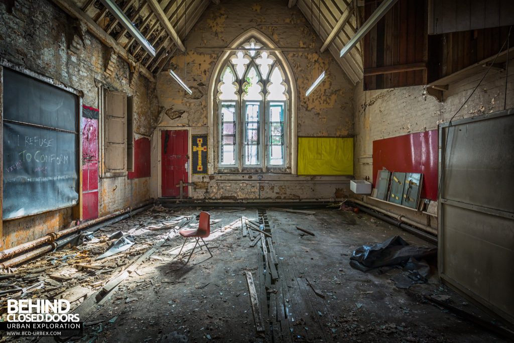 St John the Baptist School, Wigan - Chapel classroom with arched window and cross on the wall