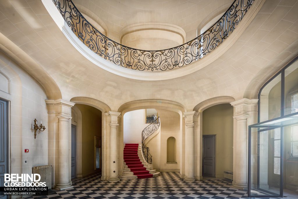 Château Sarco, France - Arches to staircase with red carpet