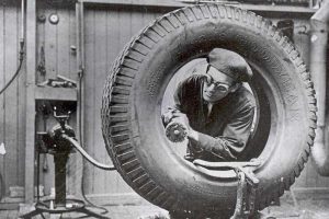 Goodyear Mixing and Retread Plant, Wolverhampton - Archive image of an employee working on a tyre