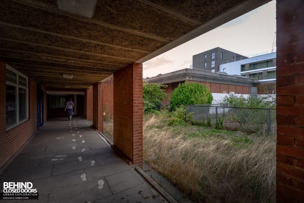 Holloway Prison - Covered walkway leading to the chapel. Note the high-security walls